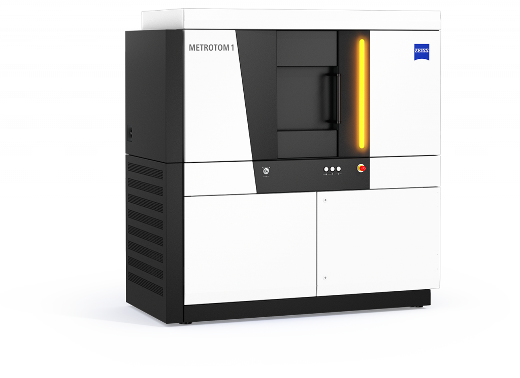 Product image of a black and white CT scanner with a orange light turned on on the front